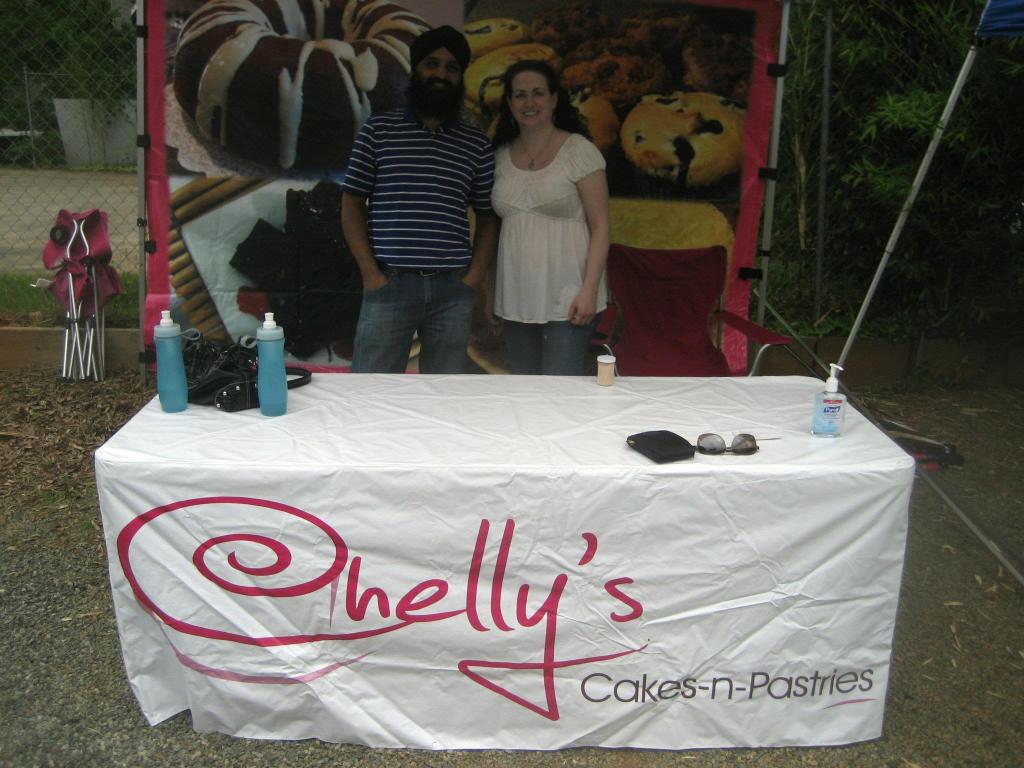 Amrik and I, (the organizers of VegCharlotte) helping out at the booth for Chelly's Cakes N Pastries.