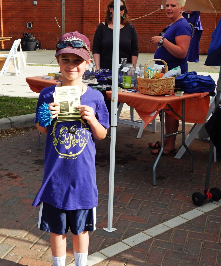 Young Man Passing Out Happy Cow Brochures