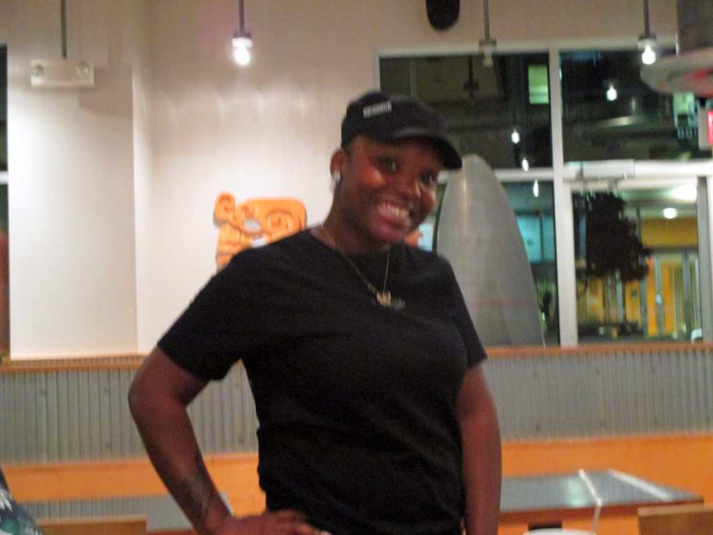 Smiling Chipotle worker